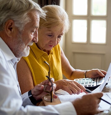 Elder Couple Revising Their Whole Life Insurance Goodyear